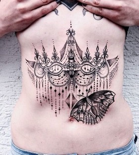 Awesome stomach tattoo design