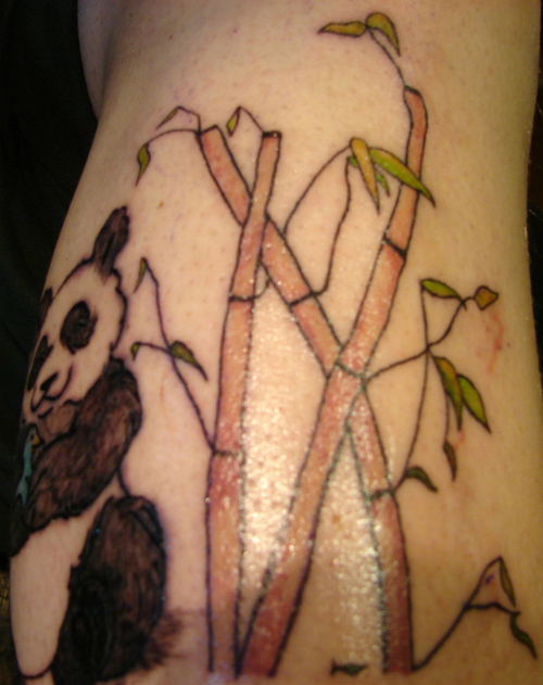 Bamboo and panda bear tattoo