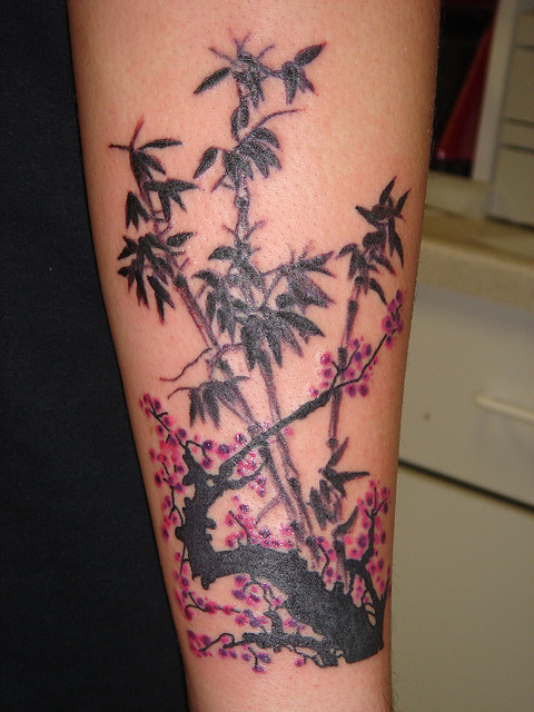 Bamboo and plum blossom tattoo