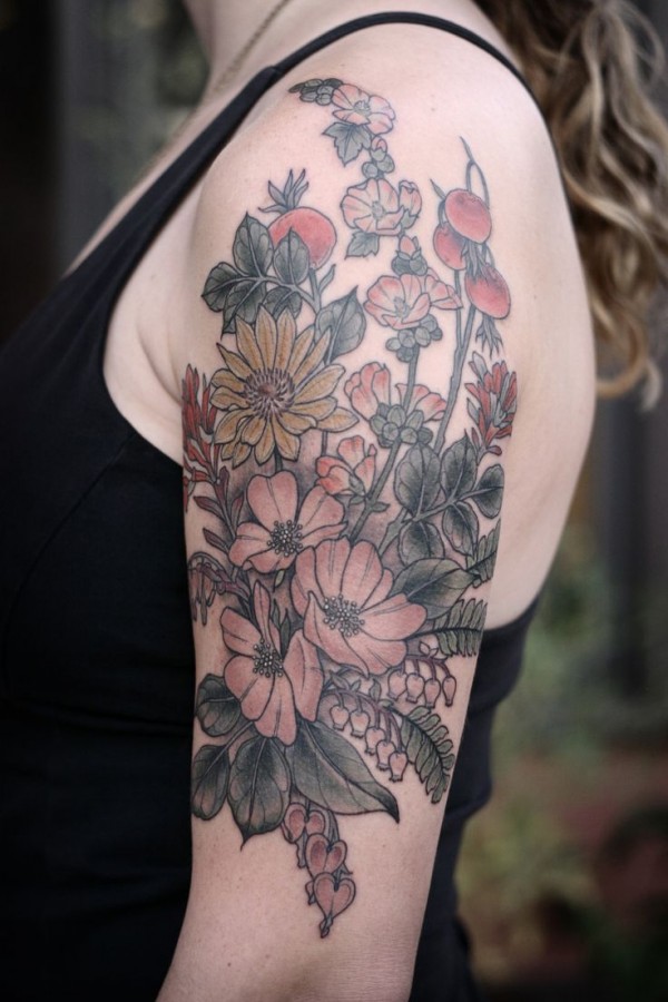 Beautiful flowers arm tattoo by Kirsten Holliday