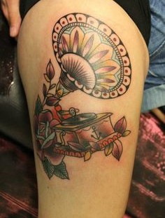 Beautiful gramophone leg tattoo