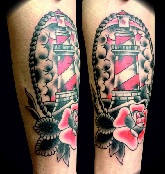 Beautiful lighthouse and rose tattoo