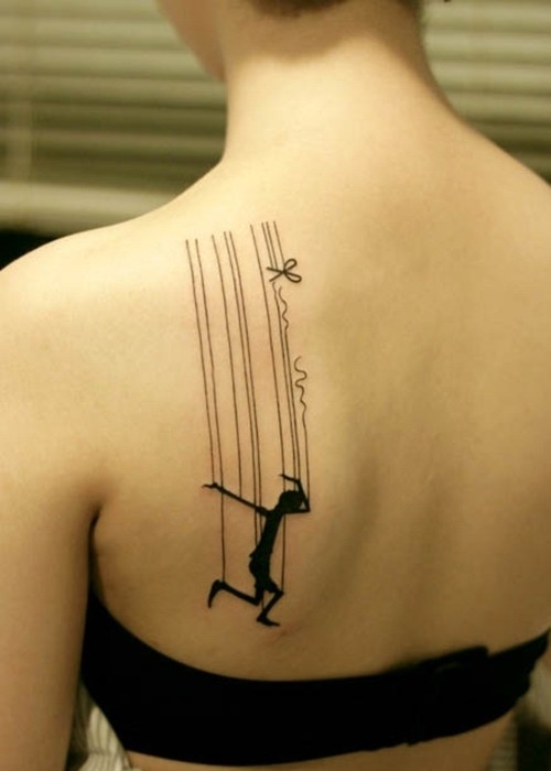 Beautiful puppet back tattoo