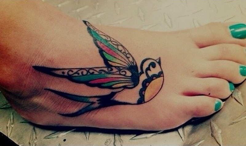 Beautiful swallow foot tattoo