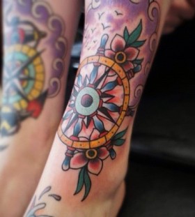 Beautiful wheel leg tattoo