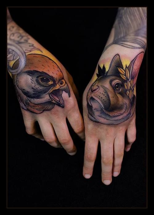 Bird and rabbit hand tattoos