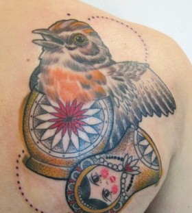 Bird inside matryoshka tattoo