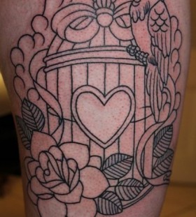 Birdcage and bird leg tattoo