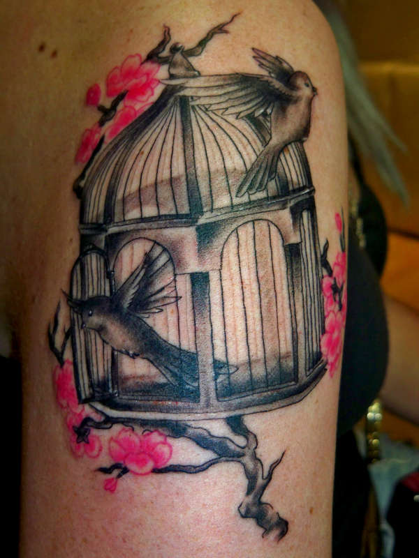 Birdcage and cherry blossom tattoo