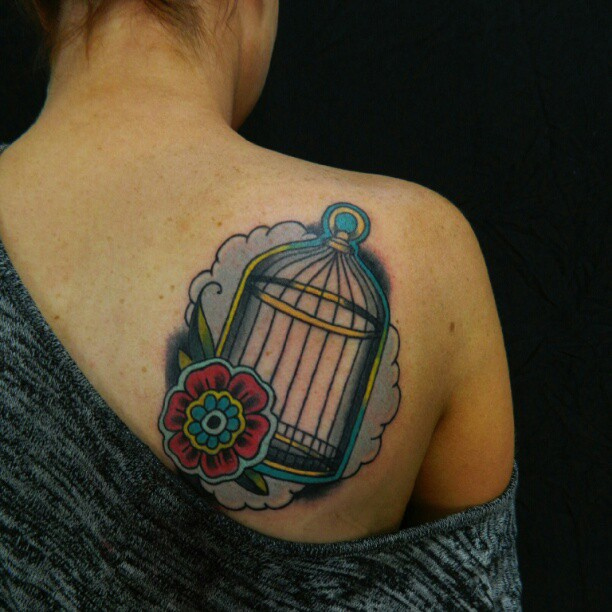 Birdcage and flower back tattoo