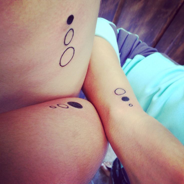 Black and white owal family love tattoo