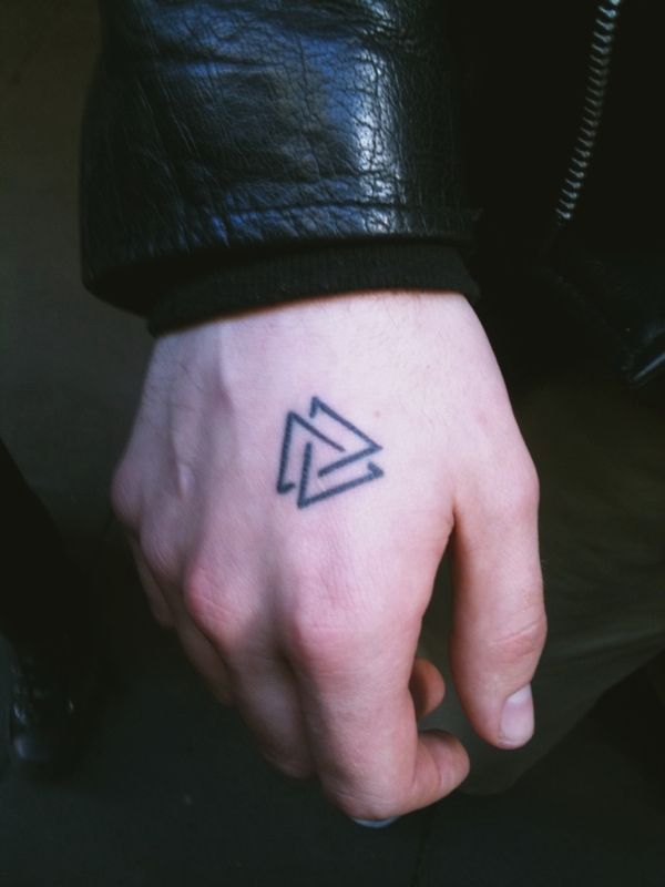 Black gorgeous triangle tattoo