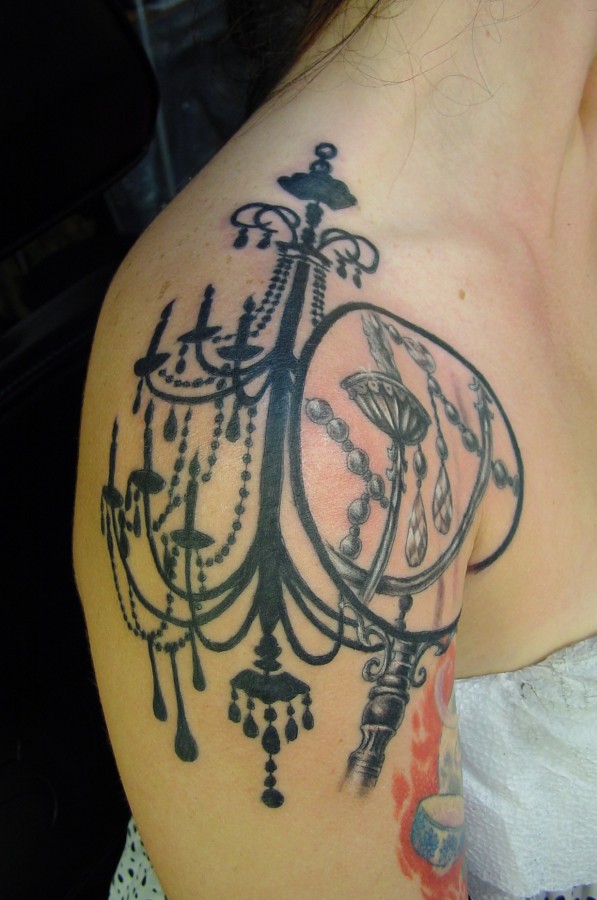 Black ink chandelier shoulder tattoo