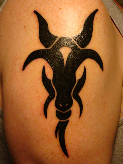 Black ink goat tattoo