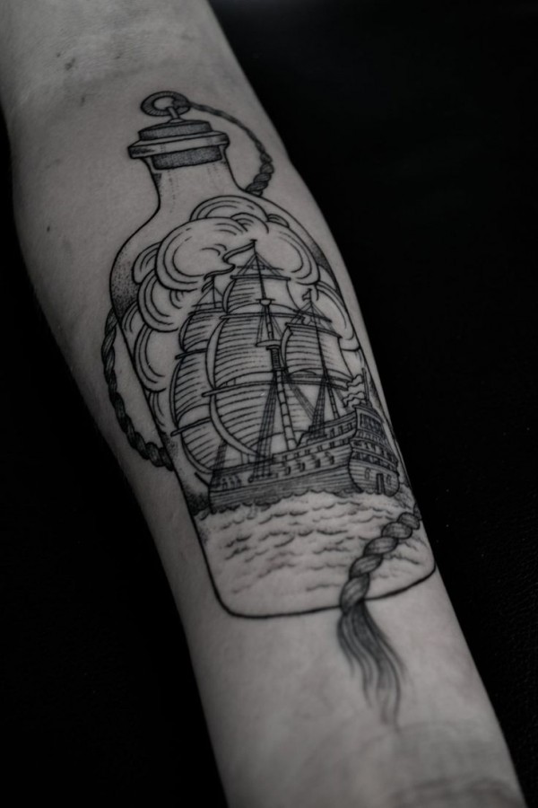 Black ship and bottle tattoo