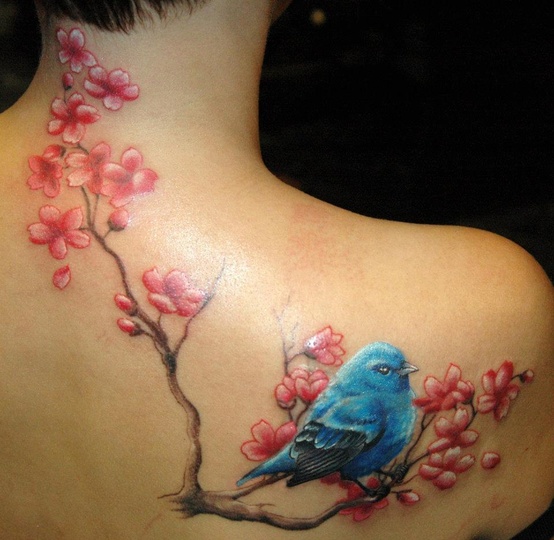 Blue bird and cherry blossom branch tattoo