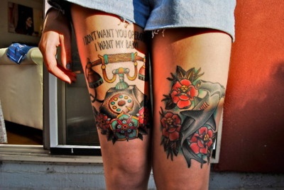 Blue fish and telephone tattoo