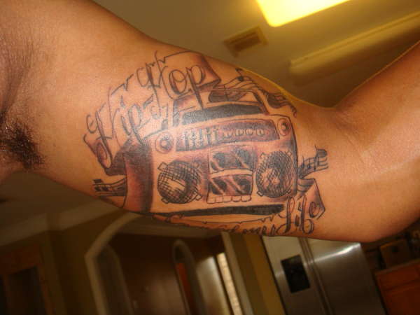 Boombox hip hop arm tattoo