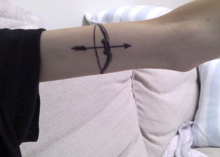 Bow and arrow arm tattoo