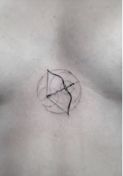 Bow and arrow chest tattoo by Dr Woo