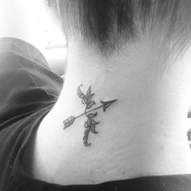 Bow and arrow neck tattoo