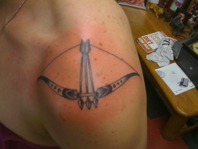 Bow and arrow shoulder tattoo