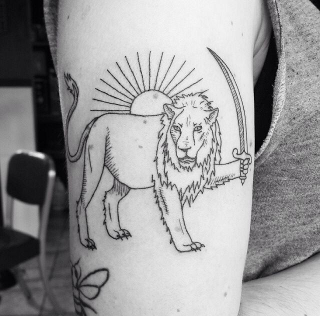 Brilliant lion with a sword tattoo