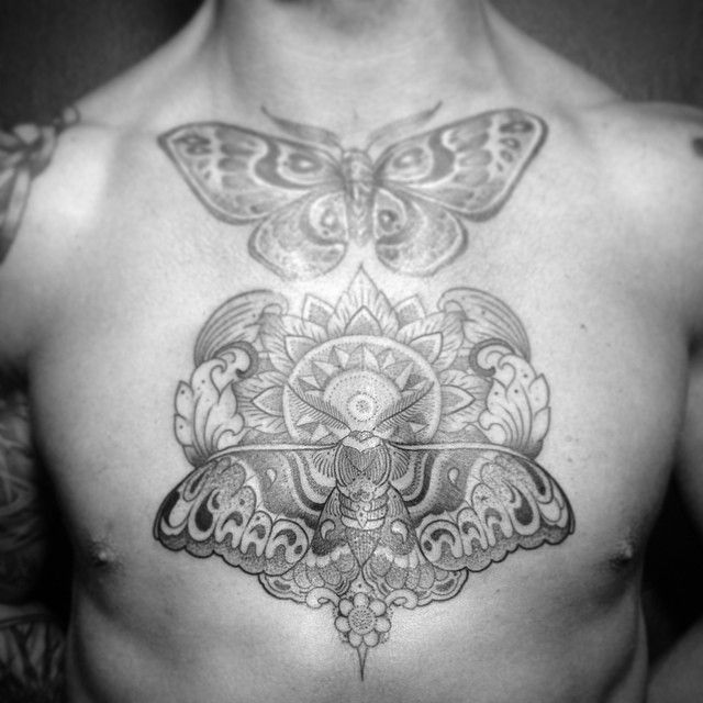 Buterflies chest tattoo by Pepe Vicio