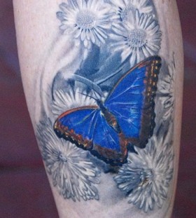 Butterfly and flowers tattoo by Phil Garcia