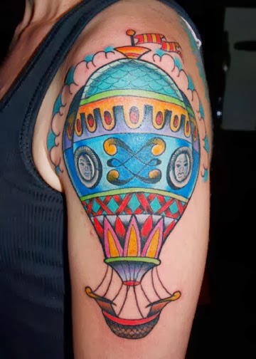 Coloured air balloon arm tattoo