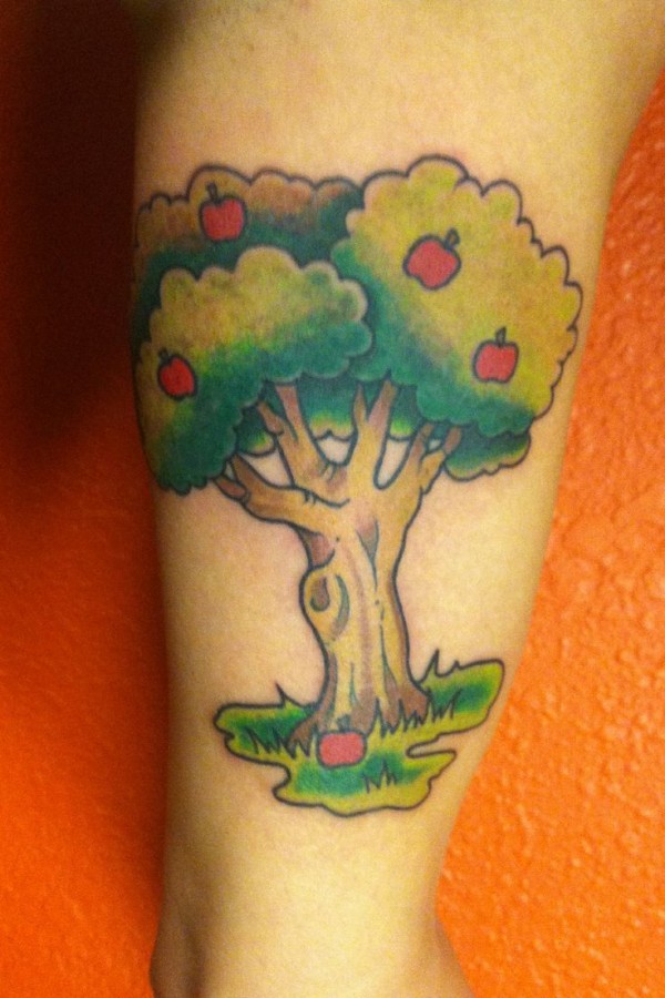 Coloured apple tree tattoo