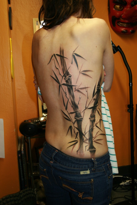 Coloured bamboo tree back tattoo