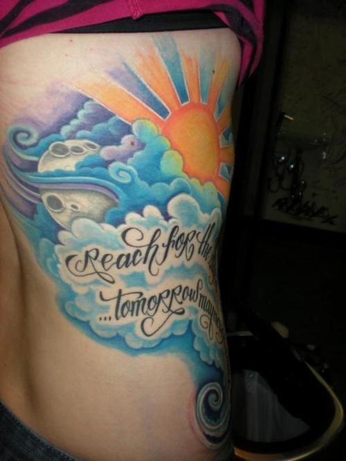 Coloured clouds side tattoo