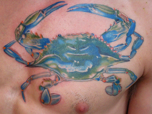 Coloured crab chest tattoo