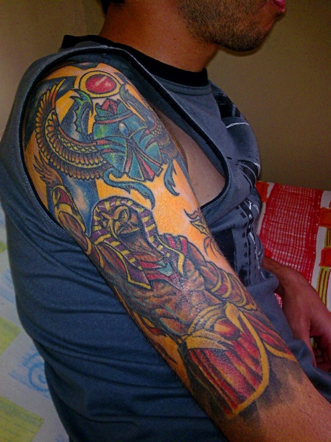 Coloured egyptian god tattoo