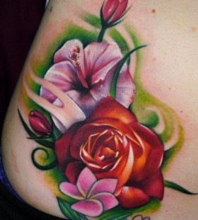Coloured flowers tattoo by Kyle Cotterman
