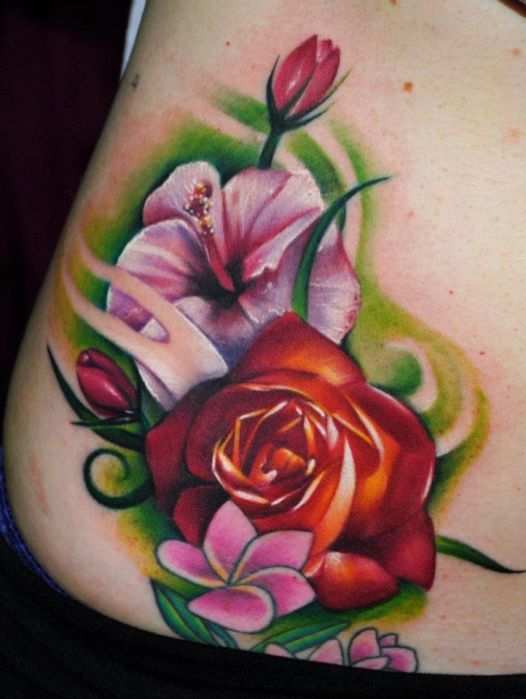 Coloured flowers tattoo by Kyle Cotterman