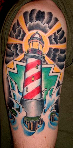 Coloured lighthouse arm tattoo