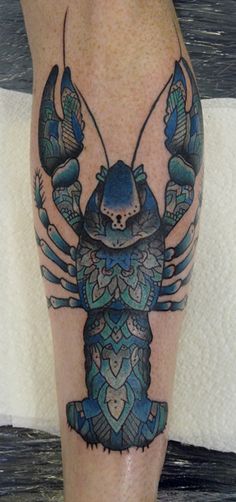 Coloured lobster leg tattoo