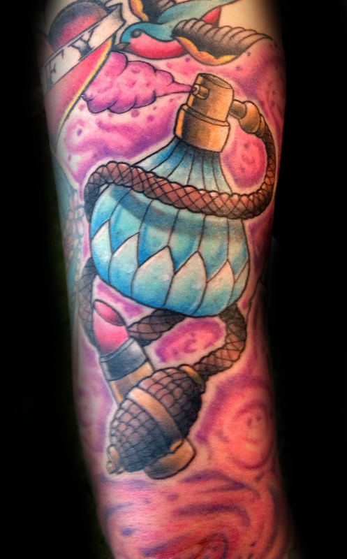 Coloured perfume bottle tattoo