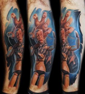 Coloured puppet master tattoo