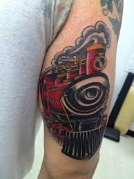 Coloured steaming train arm tattoo