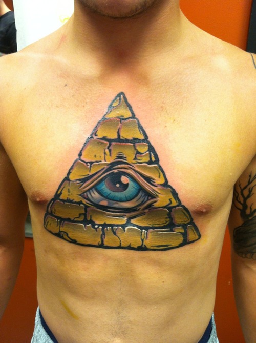 Coloured triangle eye chest tattoo