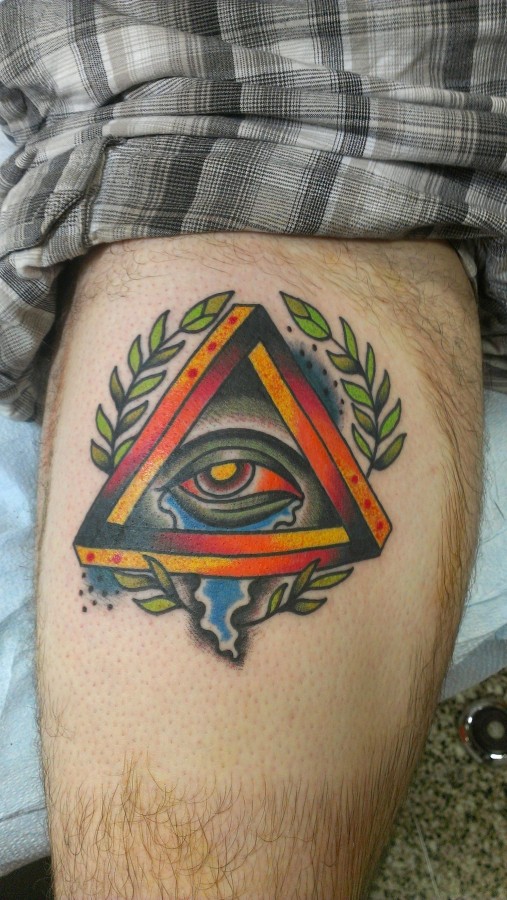 Coloured triangle eye leg tattoo