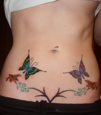 Colourful butterflies stomach tattoo