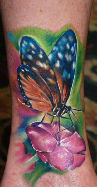 Colourful butterfly tattoo by Kyle Cotterman