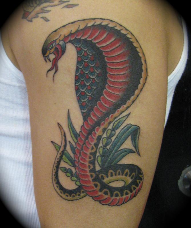 Colourful cobra arm tattoo