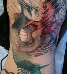 Colourful crane tattoo design