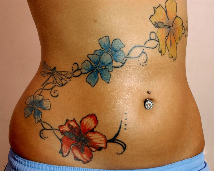 Colourful flowers stomach tattoo