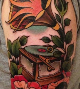 Colourful gramophone and flower tattoo